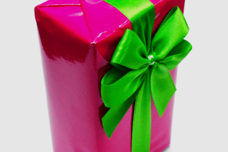 a pink gift box with a green bow